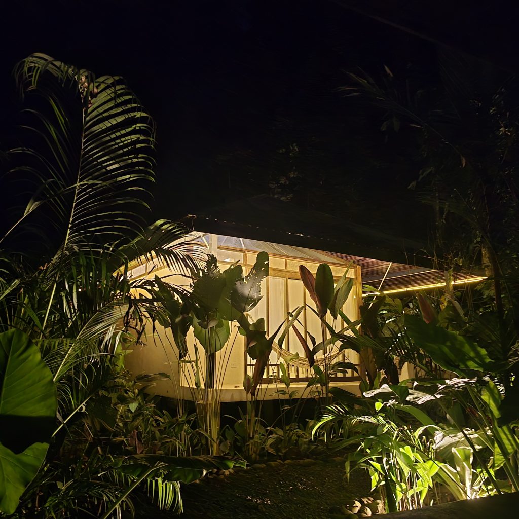 A small, screened in cabin in the jungle.